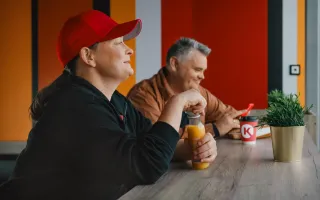 Woman and man having snacks in Circle K